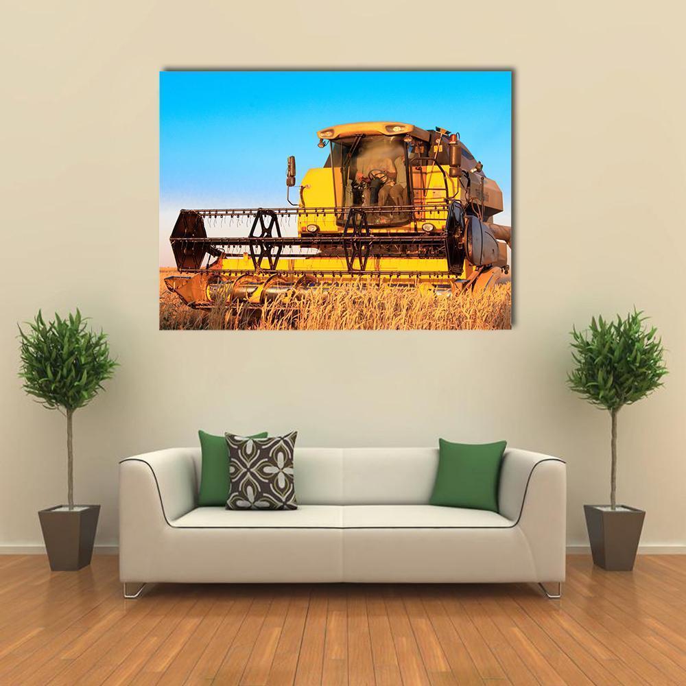 Combine Harvester in Wheat Field Canvas Wall Art in gold, yellow and blue, single panel hung on a wall