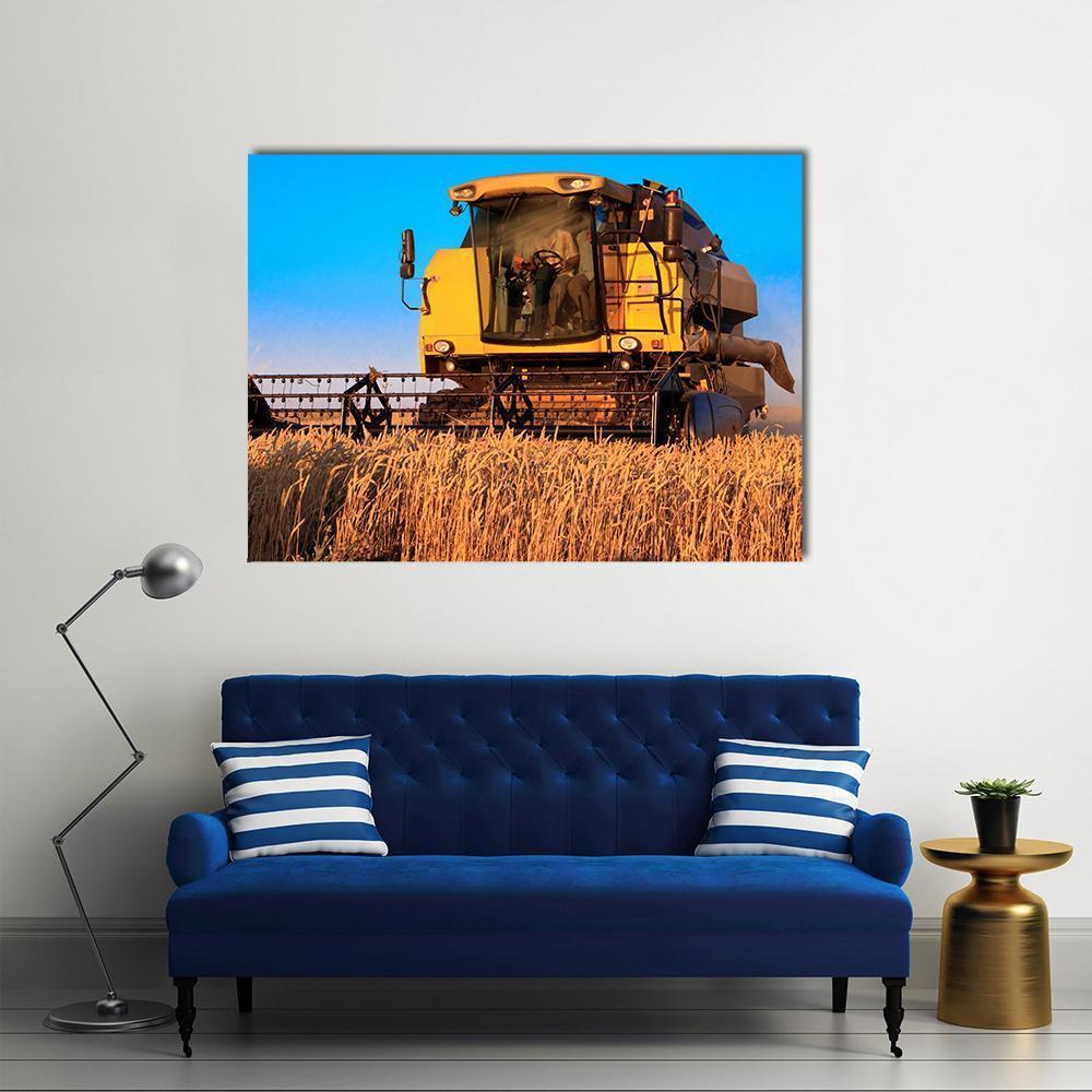 Combine Harvester in Wheat Field Canvas Wall Art in brown, yellow and blue, single panel hung on a wall