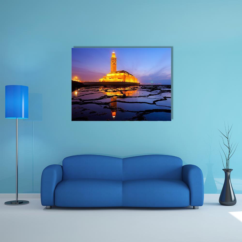 Hassan Ii Mosque at Twilight Canvas Wall Art in orange, yellow and blue, single panel hung on a wall