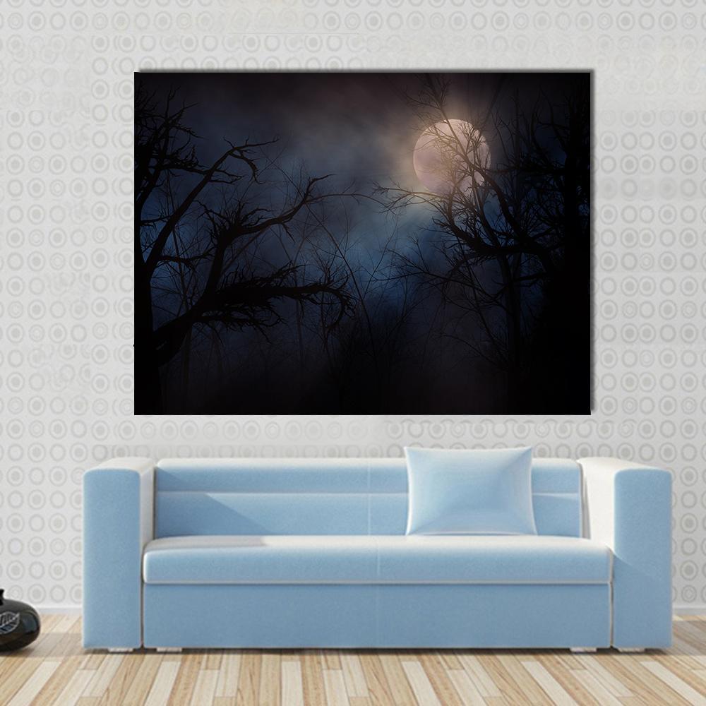 Haunted Trees Under Moon Canvas Wall Art in black, gray and blue, single panel hung on a wall