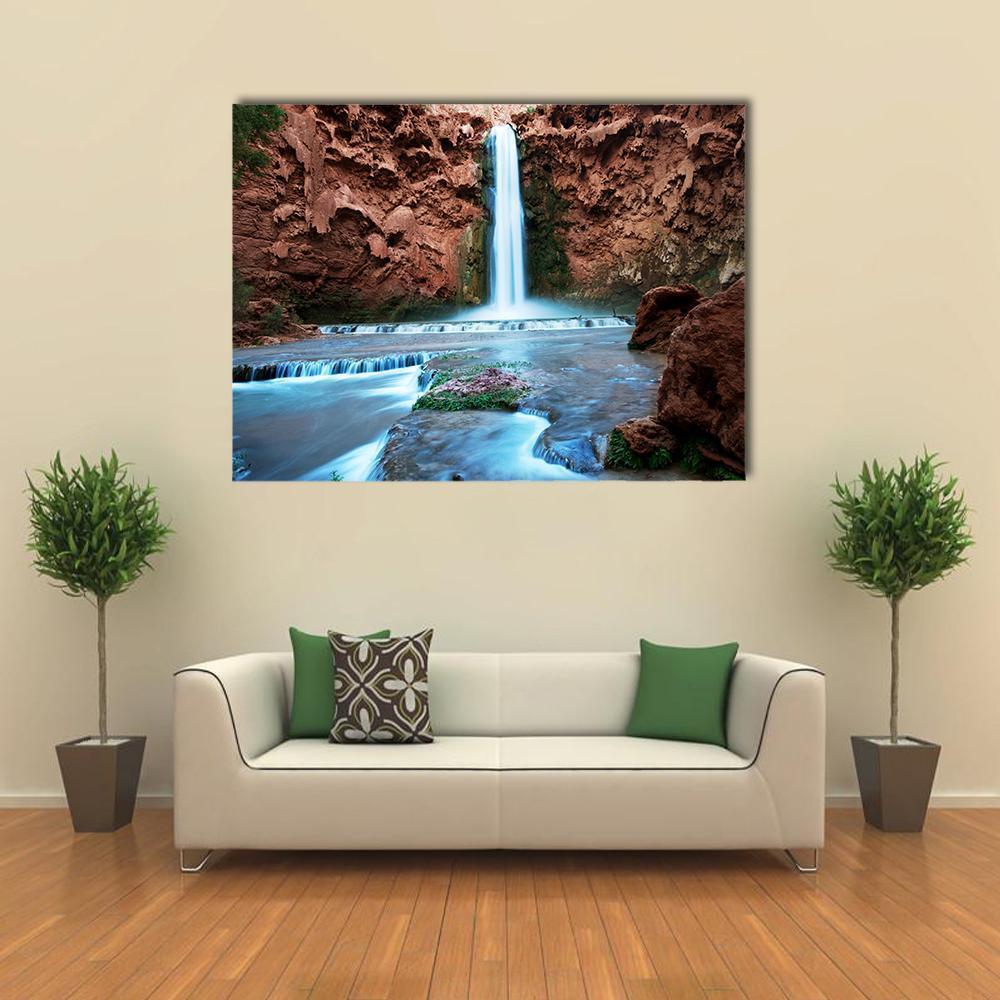 Havasu Falls Canvas Wall Art in brown, orange and blue, single panel hung on a wall