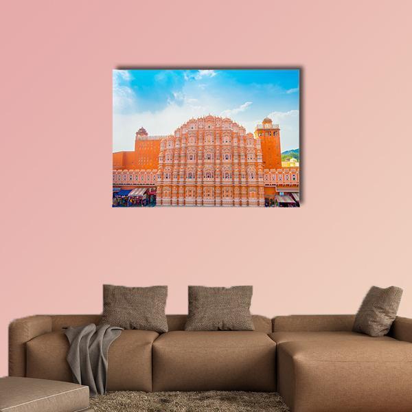 Hawa Mahal in Jaipur Canvas Wall Art in orange, blue and pink, single panel hung on a wall
