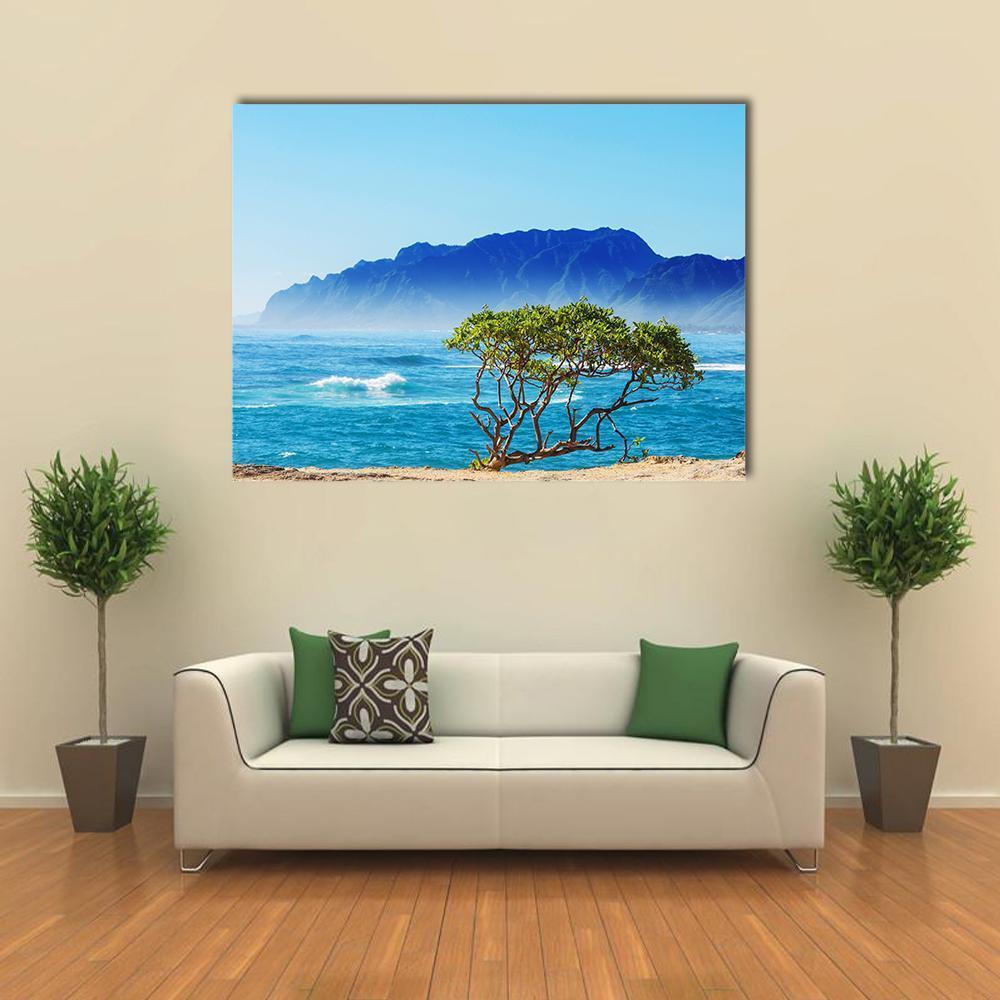 Hawaii Beach Scene Canvas Wall Art in green, blue and navy, single panel hung on a wall