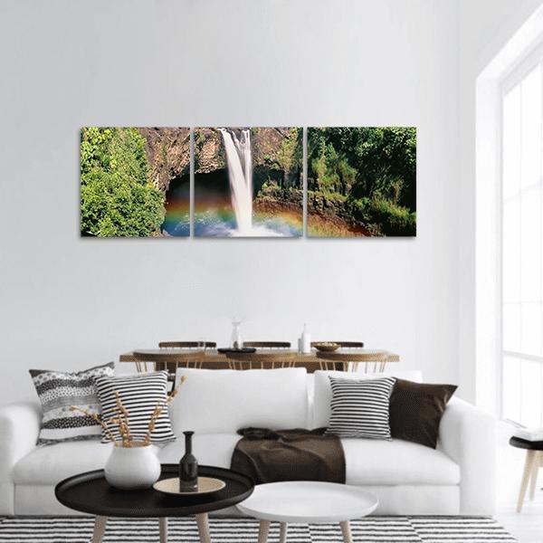 Hawaii Rainbow Falls Lush Waterfall Scene Panoramic Canvas Wall Art in brown, green and blue, hung on a wall