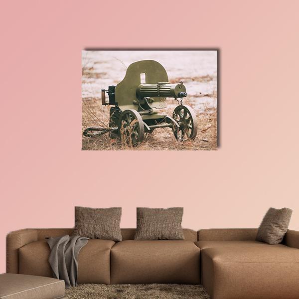 Vintage Heavy Machine Gun on Wheeled Mount Canvas Wall Art in beige, brown and green, single panel hung on a wall