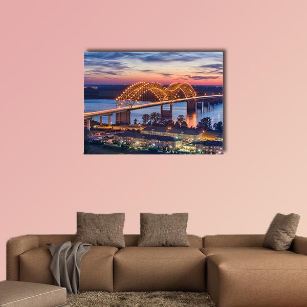 Hernando De Soto Bridge at Sunset Canvas Wall Art in orange, blue and purple, single panel hung on a wall