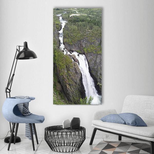 High Mountain Waterfall in Norway Vertical Canvas Wall Art in white, gray and green, single vertical panel hung on a wall