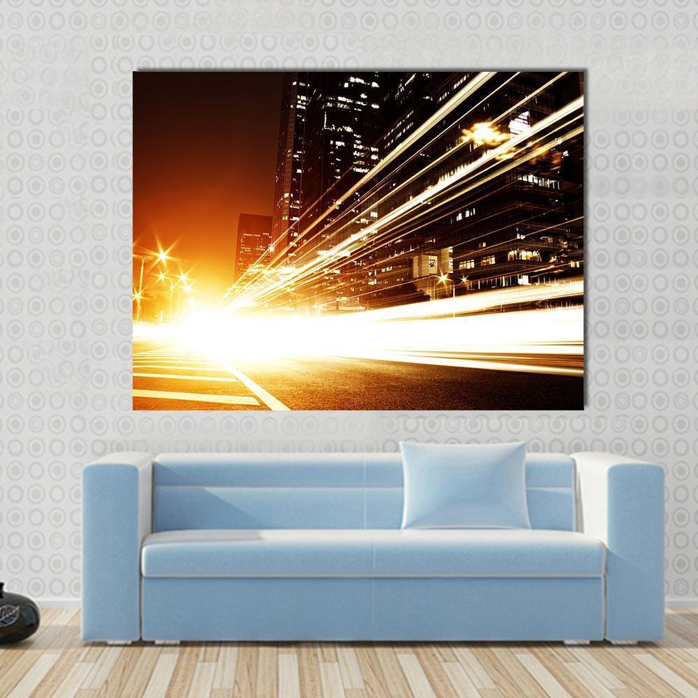 High Speed Cars at Night Canvas Wall Art in black, orange and yellow, single panel hung on a wall