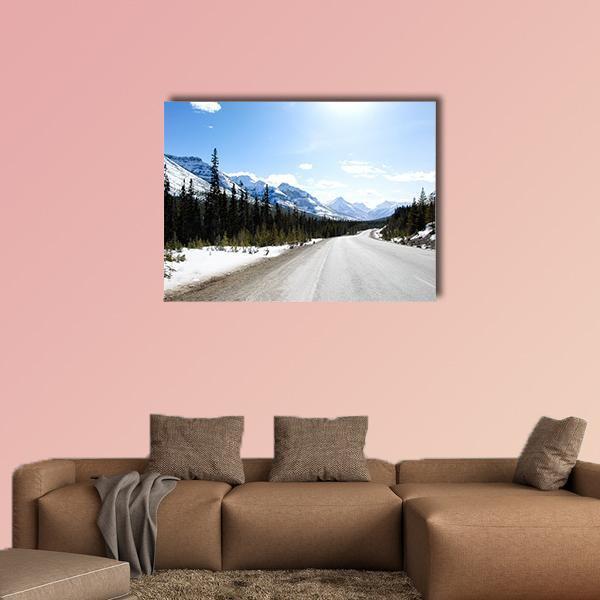 Snowy Mountain Highway in Canada Canvas Wall Art in white, gray and blue, single panel hung on a wall