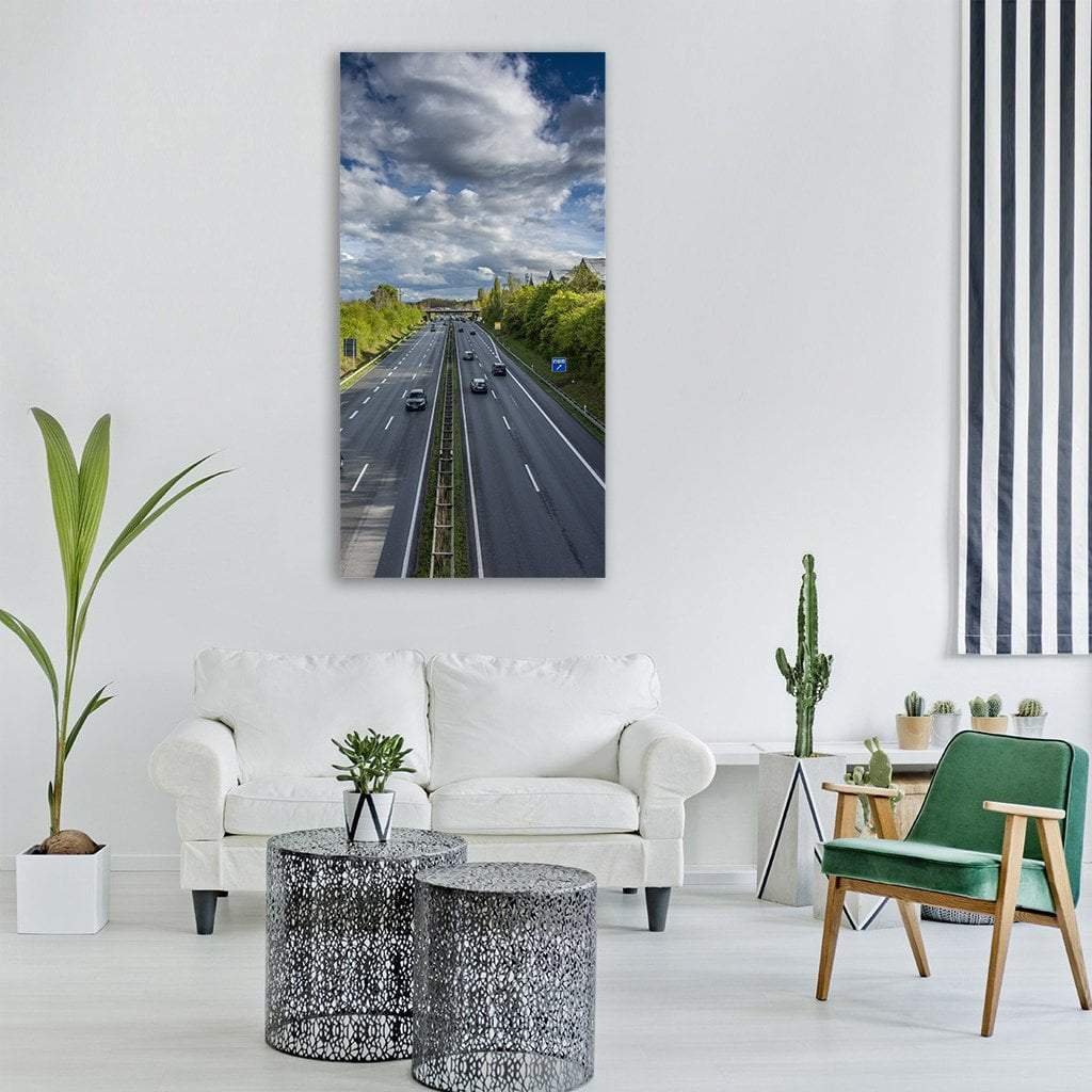 Highway in Hannover, Germany Vertical Canvas Wall Art in gray, green and blue, single vertical panel hung on a wall