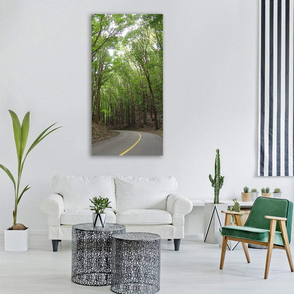 Philippine Forest Highway Vertical Canvas Wall Art in gray, brown and green, single vertical panel hung on a wall