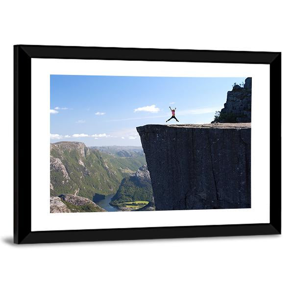 Hiker Jumping On Preikestolen Canvas Wall Art-3 Horizontal-Gallery Wrap-25" x 16"-Tiaracle