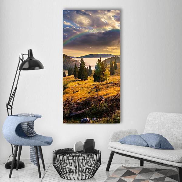Hillside with Coniferous Forest Vertical Canvas Wall Art in yellow, green and blue, single vertical panel hung on a wall