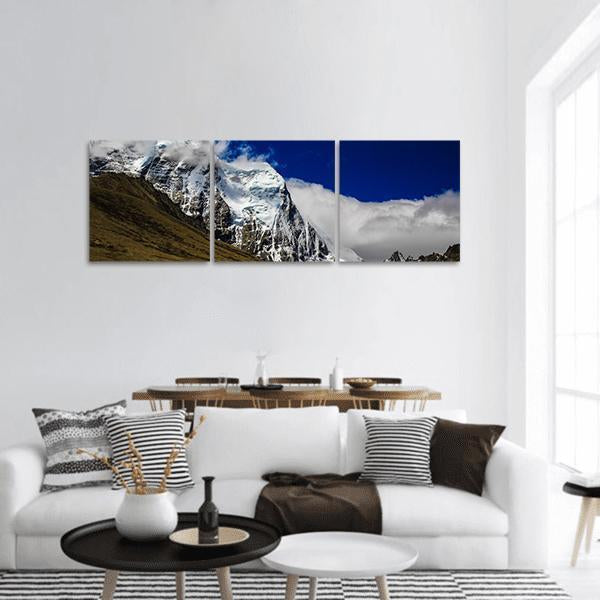 Himalayan Snow-capped Mountain Range Panoramic Canvas Wall Art in white, brown and blue, hung on a wall