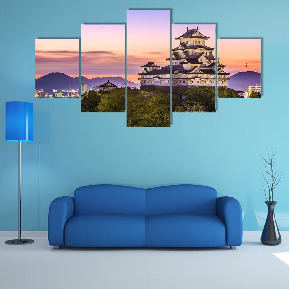 Himeji Castle at Twilight Canvas Wall Art in orange, blue and purple, 5 panel Star layout hung on a wall