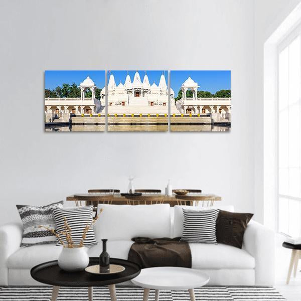 White Hindu Temple with Reflecting Water, Atlanta Panoramic Canvas Wall Art in white and blue, hung on a wall