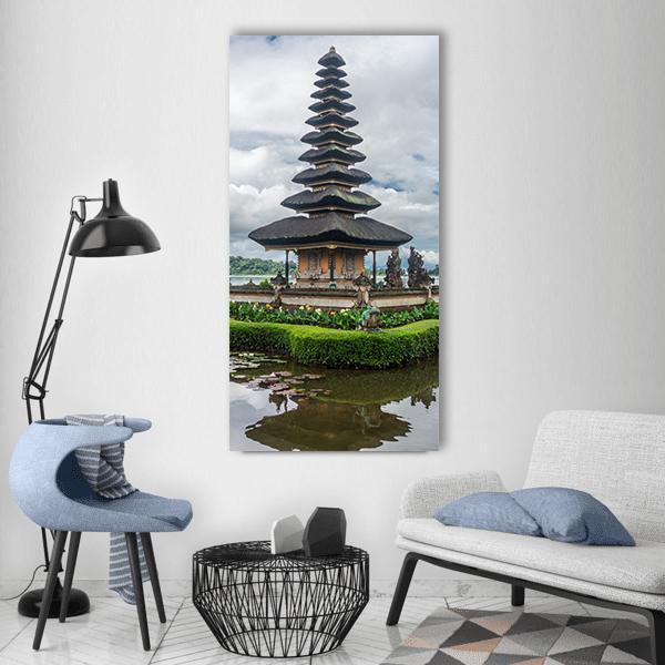 Balinese Meru Hindu Temple Reflection Vertical Canvas Wall Art in gray, brown and green, single vertical panel hung on a wall