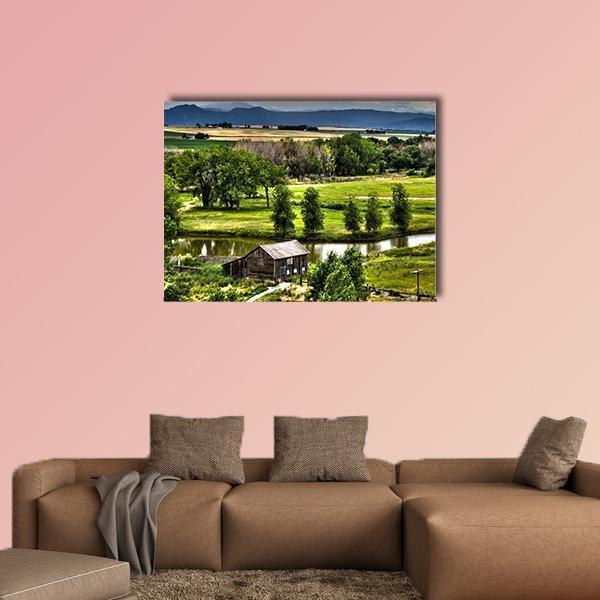 Historic Family Homestead Canvas Wall Art in brown, green and blue, single panel hung on a wall