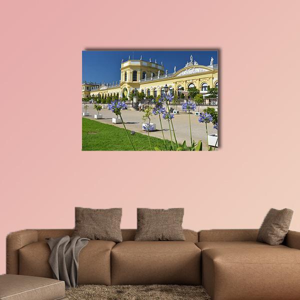 Orangerie and Gardens in Kassel Canvas Wall Art in yellow, green and blue, single panel hung on a wall