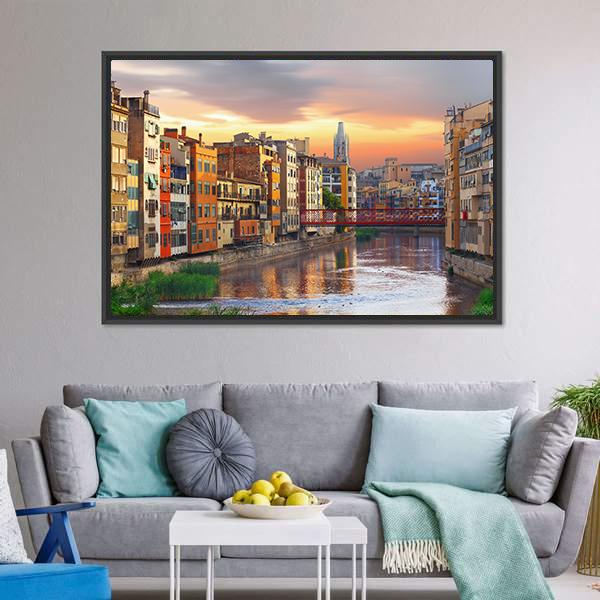 Girona Jewish Quarter River at Sunset Canvas Wall Art in orange, yellow and blue, framed canvas, product view on a white background