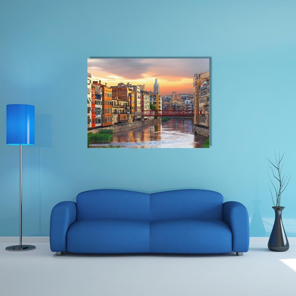 Girona Jewish Quarter River at Sunset Canvas Wall Art in orange, yellow and blue, single panel hung on a wall