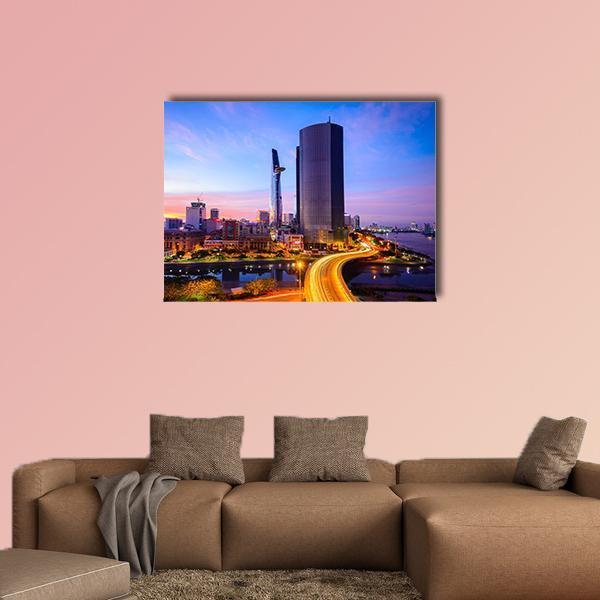 Ho Chi Minh City Night Skyline Canvas Wall Art in orange, blue and purple, single panel hung on a wall