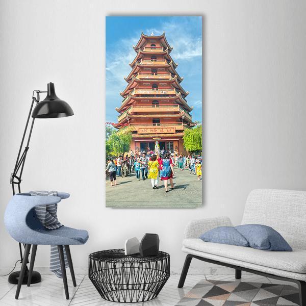 Ho Chi Minh City Pagoda Courtyard Vertical Canvas Wall Art in gray, orange and blue, single vertical panel hung on a wall