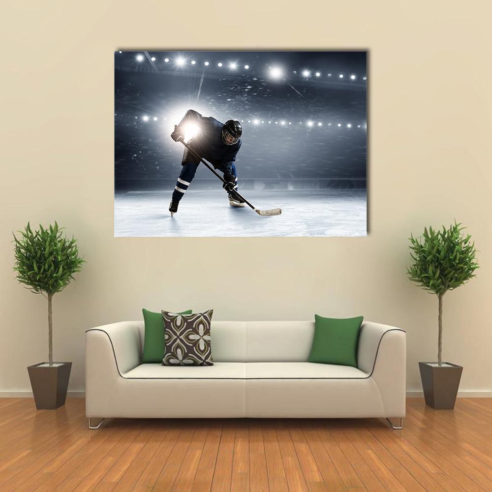 Hockey Player in Action at Ice Rink Canvas Wall Art in black, white and gray, single panel hung on a wall