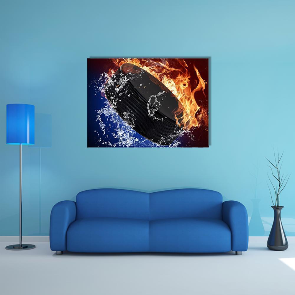 Hockey Puck with Flames and Water Canvas Wall Art in black, orange and blue, single panel hung on a wall