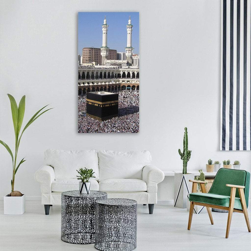 Kaaba and Pilgrims at Masjid Al-haram Vertical Canvas Wall Art in black, white and blue, single vertical panel hung on a wall