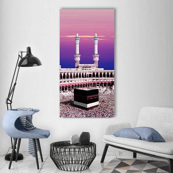 Kaaba at Twilight, Masjid Al-haram Vertical Canvas Wall Art in black, purple and pink, single vertical panel hung on a wall