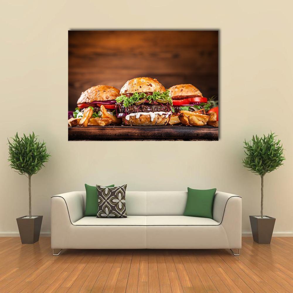 Homemade Burgers with French Fries Canvas Wall Art in brown, red and yellow, single panel hung on a wall