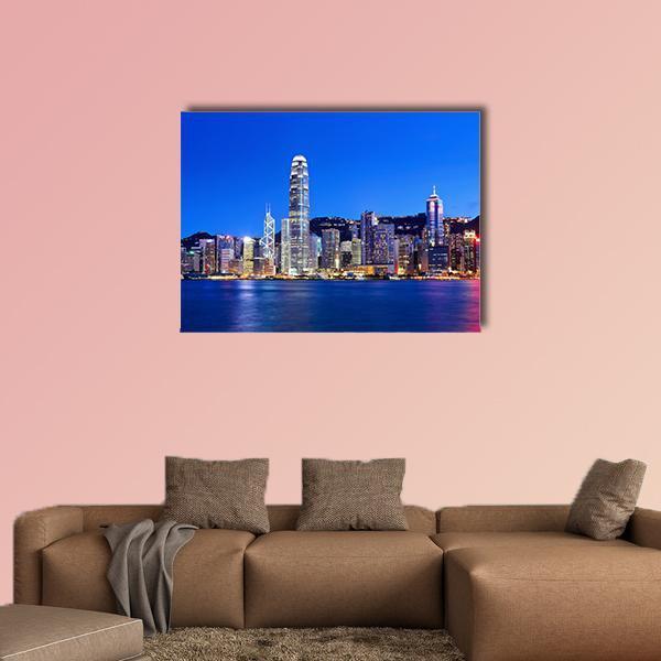 Hong Kong Night Skyline Canvas Wall Art in blue, single panel hung on a wall