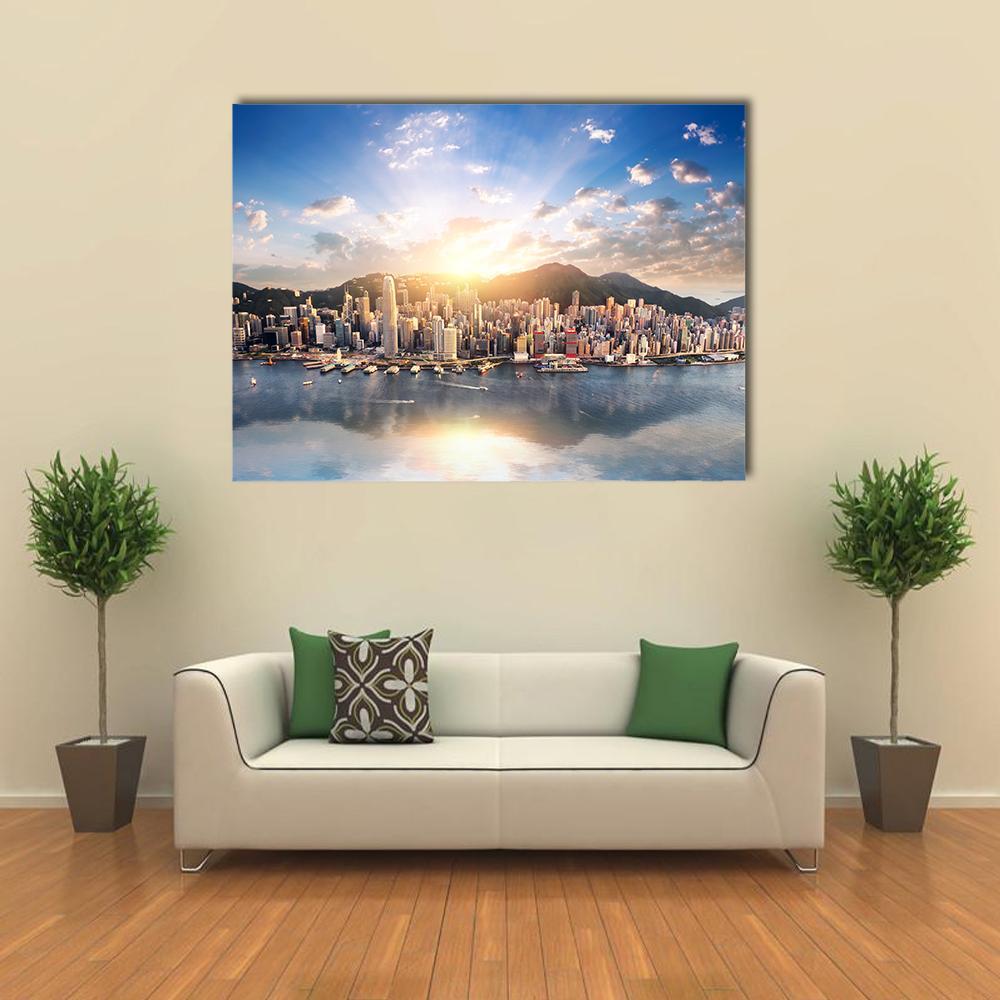 Hong Kong Skyline at Sunset Canvas Wall Art in orange, yellow and blue, single panel hung on a wall
