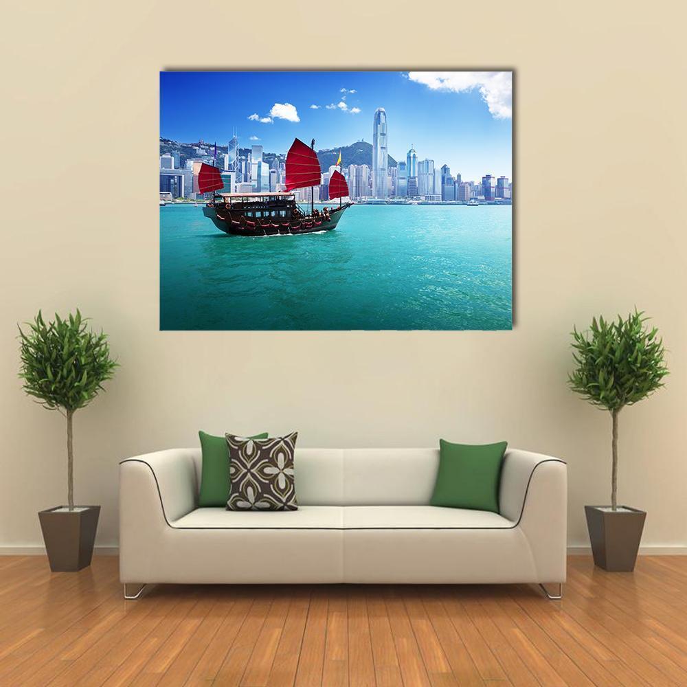 Hong Kong Harbour with Red-sailed Boat Canvas Wall Art in red and blue, single panel hung on a wall