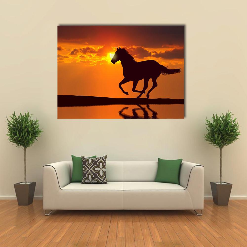 Galloping Horse Silhouette at Sunset Canvas Wall Art in black, orange and yellow, single panel hung on a wall