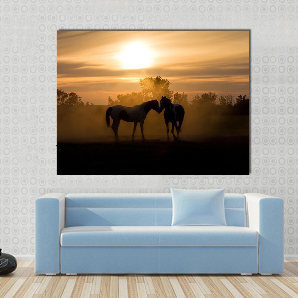 Horses in Love Canvas Wall Art in black, orange and yellow, single panel hung on a wall