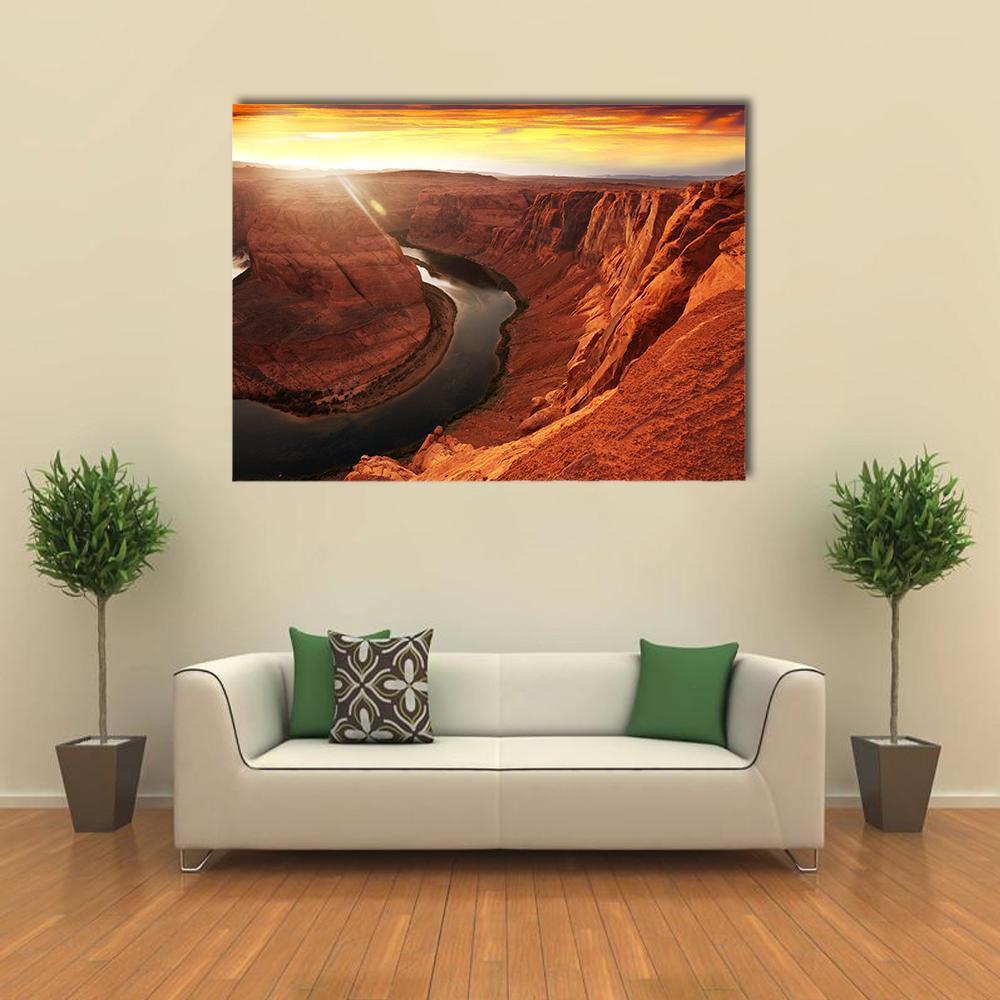 Horseshoe Bend at Sunset Canvas Wall Art in brown, orange and yellow, single panel hung on a wall