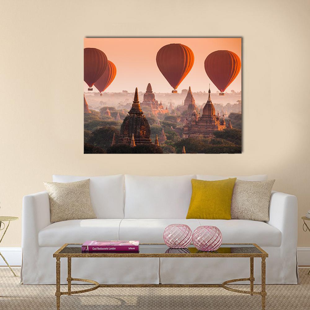 Hot Air Balloons Over Bagan Sunrise Canvas Wall Art in brown, orange and yellow, single panel hung on a wall