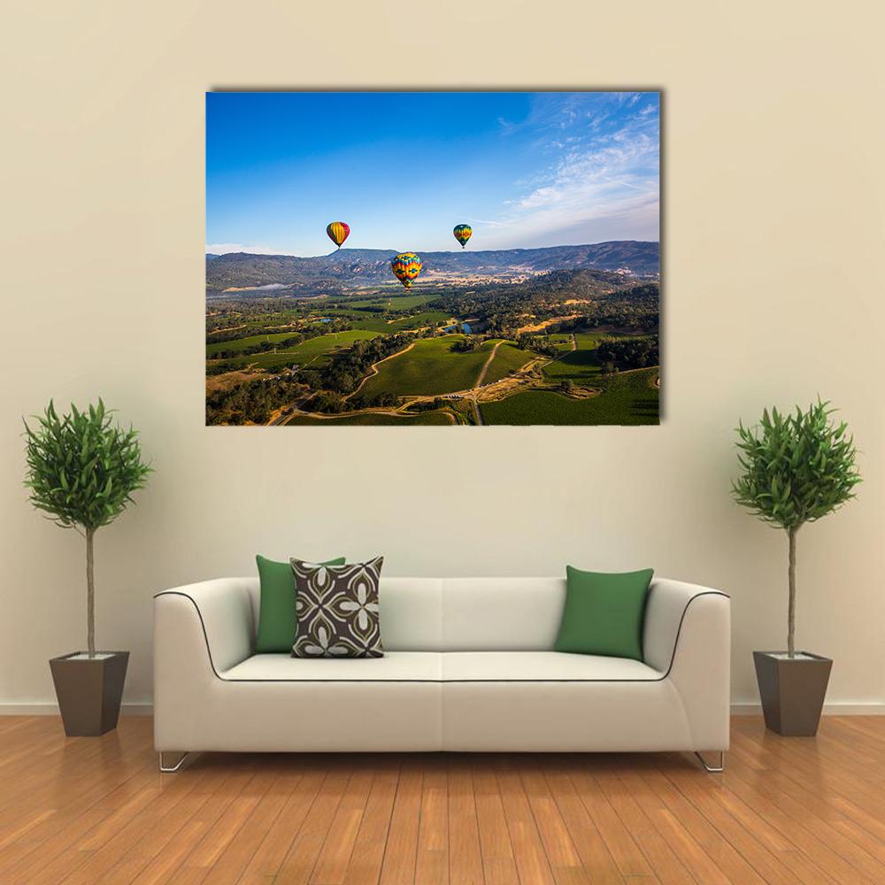 Hot Air Balloons Over Napa Valley Canvas Wall Art in green and blue, single panel hung on a wall