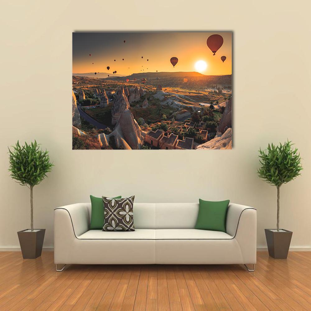 Hot Air Balloons Over Cappadocia Canvas Wall Art in brown, orange and yellow, single panel hung on a wall
