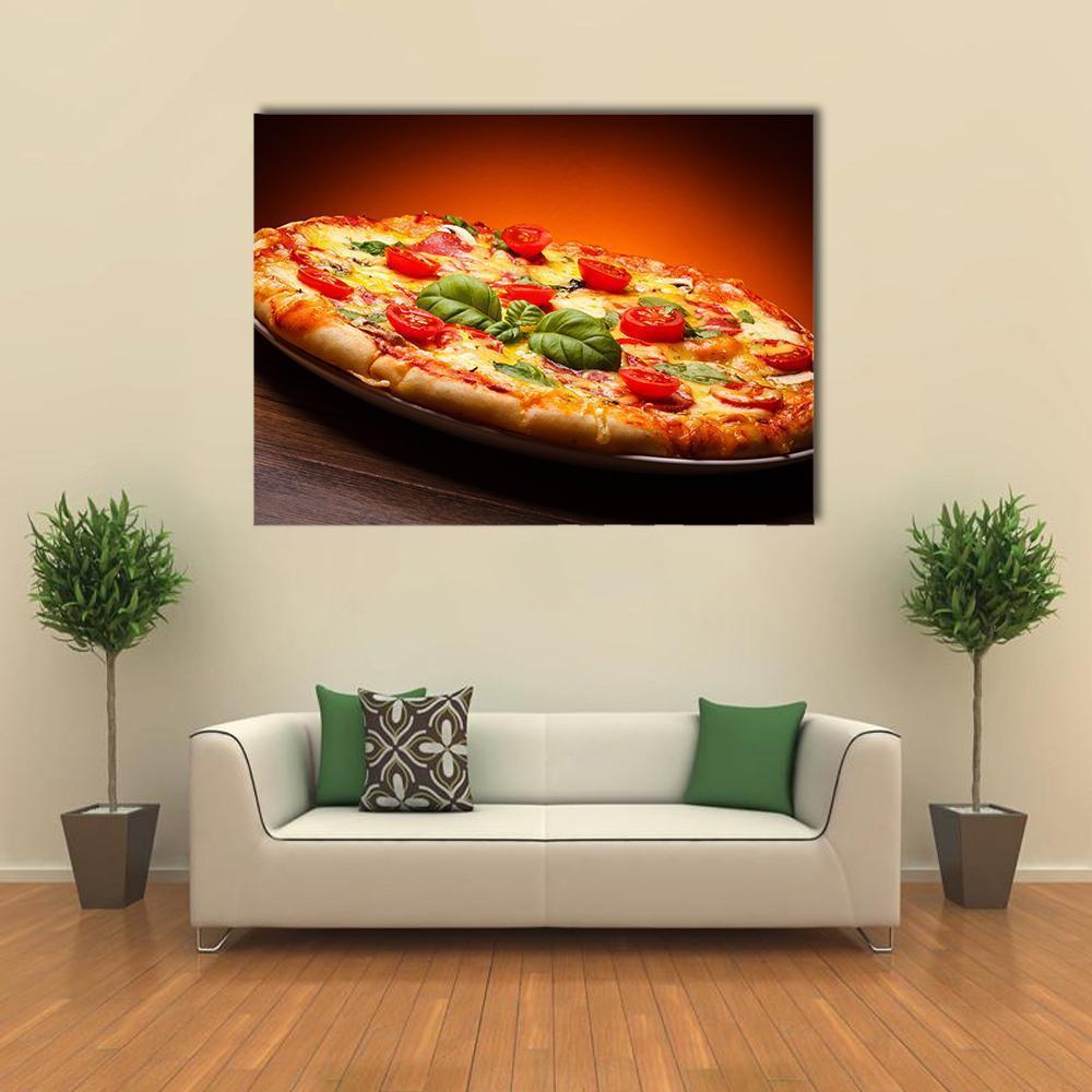 Hot and Spicy Pizza Canvas Wall Art in red, orange and yellow, single panel hung on a wall
