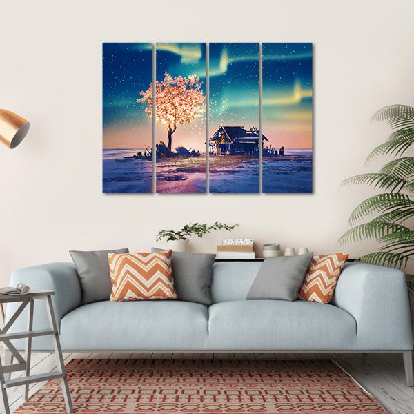 Weathered Shack and Glowing Tree Under Northern Lights Canvas Wall Art in blue, purple and pink, hung on a wall