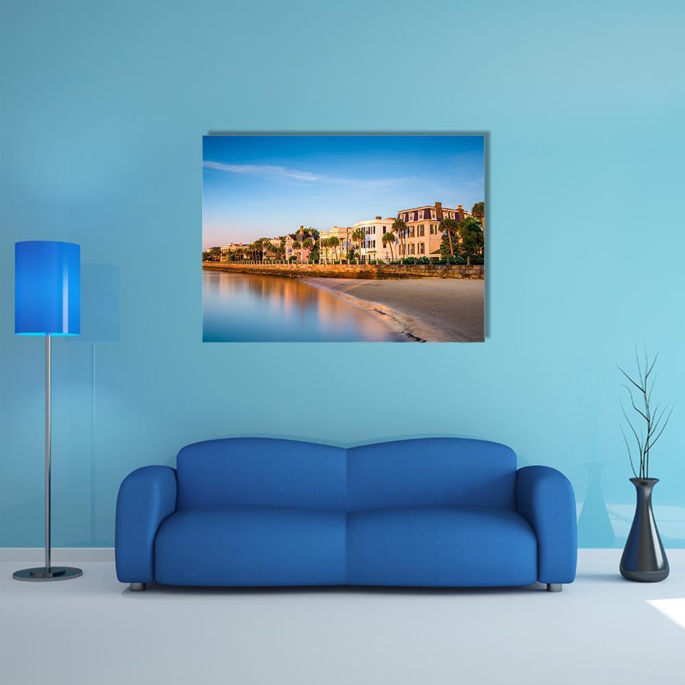 Charleston Waterfront Houses Canvas Wall Art in beige, orange and blue, single panel hung on a wall