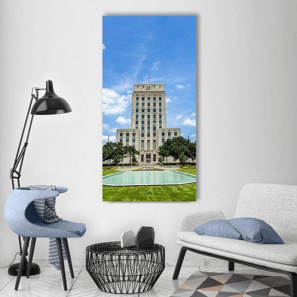 Houston City Hall with Reflecting Pool Vertical Canvas Wall Art in gray, green and blue, single vertical panel hung on a wall
