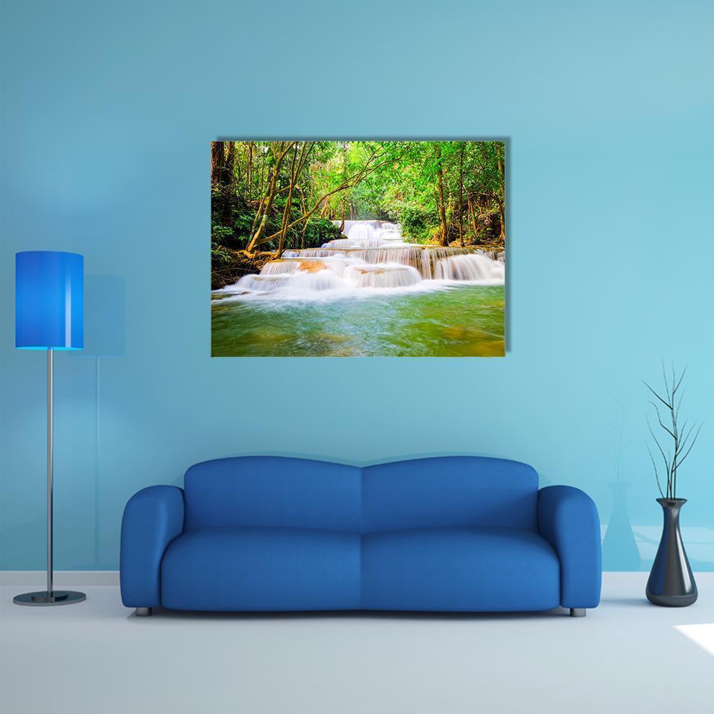 Huai Mae Khamin Waterfall Canvas Wall Art in white, brown and green, single panel hung on a wall
