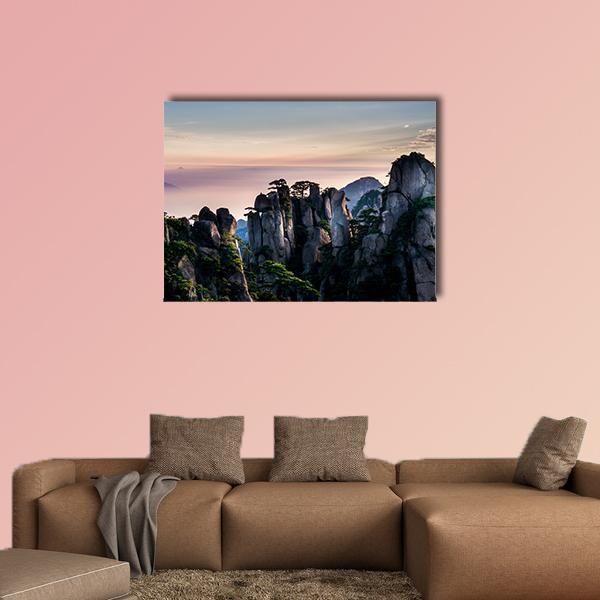 Huangshan Mountain in Anhui at Dawn Canvas Wall Art in orange, blue and pink, single panel hung on a wall