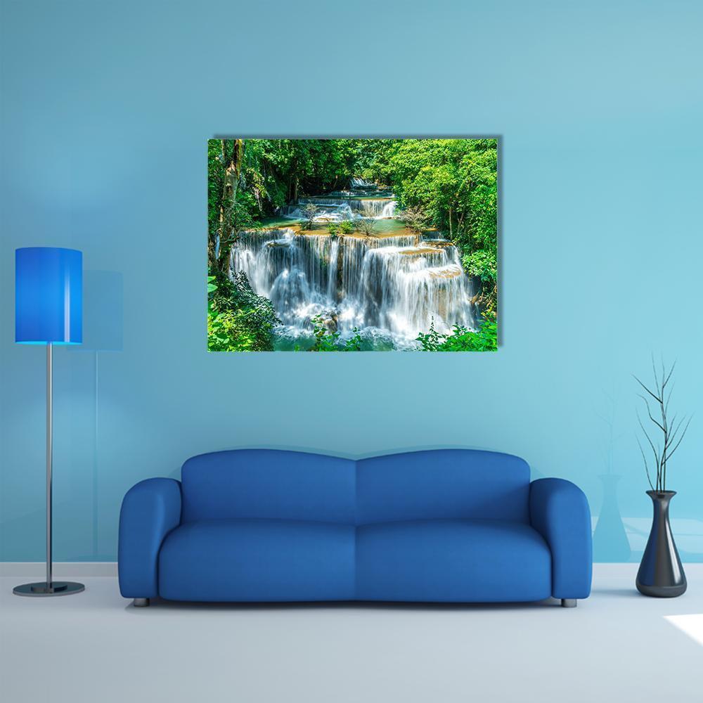 Huay Mae Kamin Waterfall Canvas Wall Art in white, green and blue, single panel hung on a wall