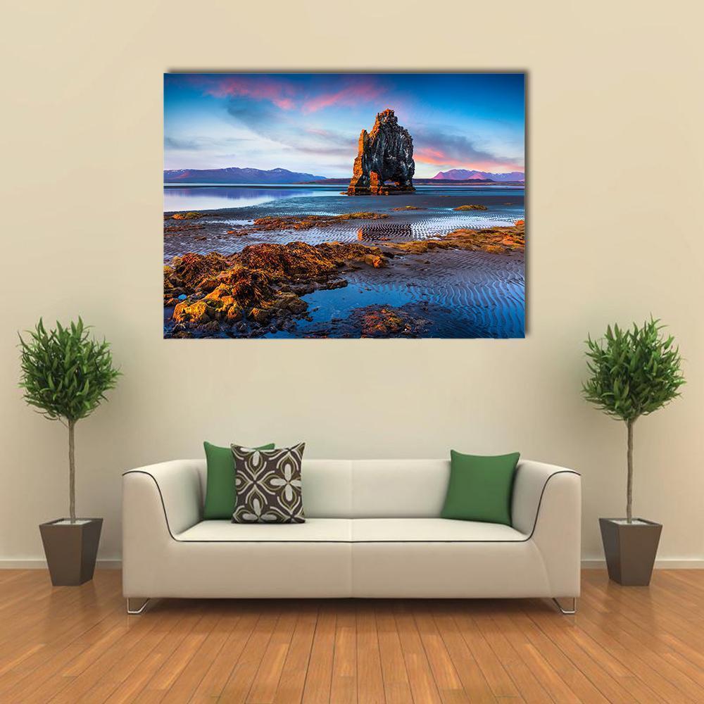 Basalt Sea Stack at Sunset Canvas Wall Art in brown, orange and blue, single panel hung on a wall
