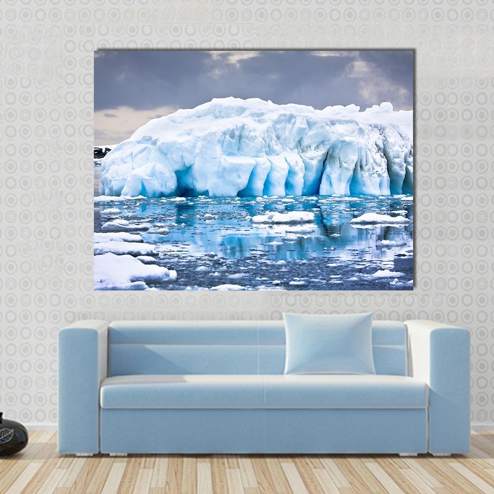 Huge Iceberg in Antarctica Canvas Wall Art in white, gray and blue, single panel hung on a wall